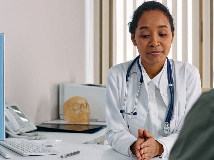 A doctor advising a patient on preventative care