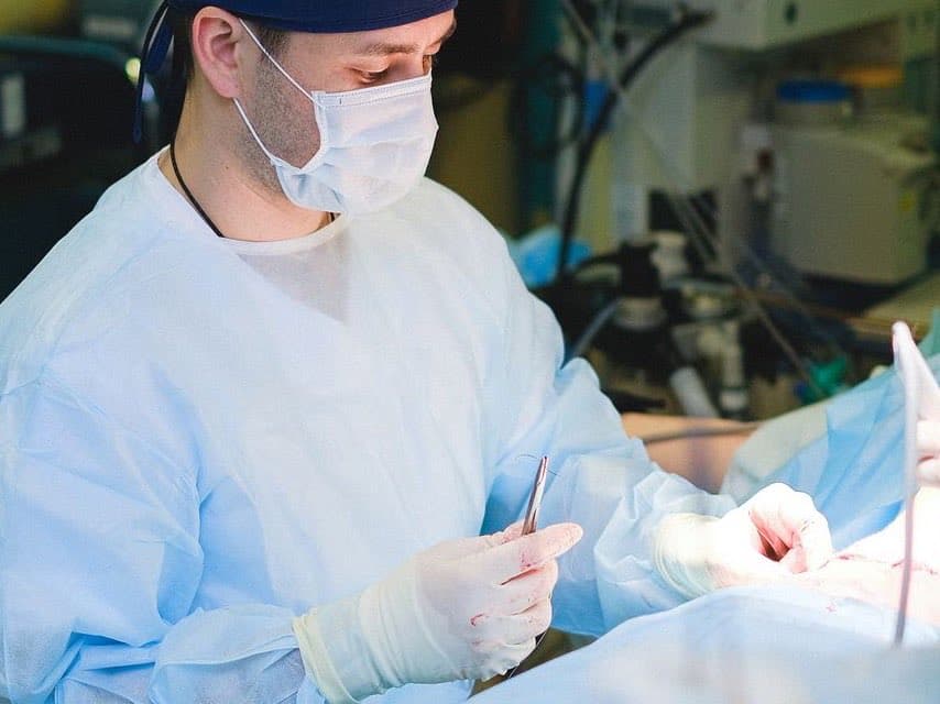 A surgeon at work in an operating room